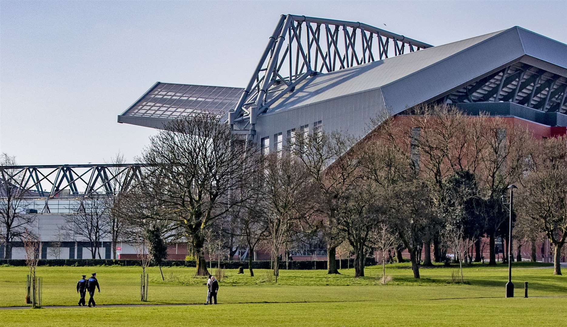 A couple of police officers walk through Stanley Park in Liverpool (Peter Byrne/PA)