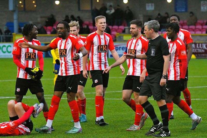 Players are upset after a challenge on Jacob Lamber. Lancing v Sheppey, Isthmian South East, 071224 Picture: Marc Richards