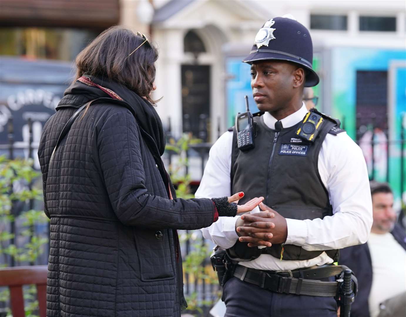 Sergeant Leo Boateng speaking to a member of the public (Danielle Desouza/PA)