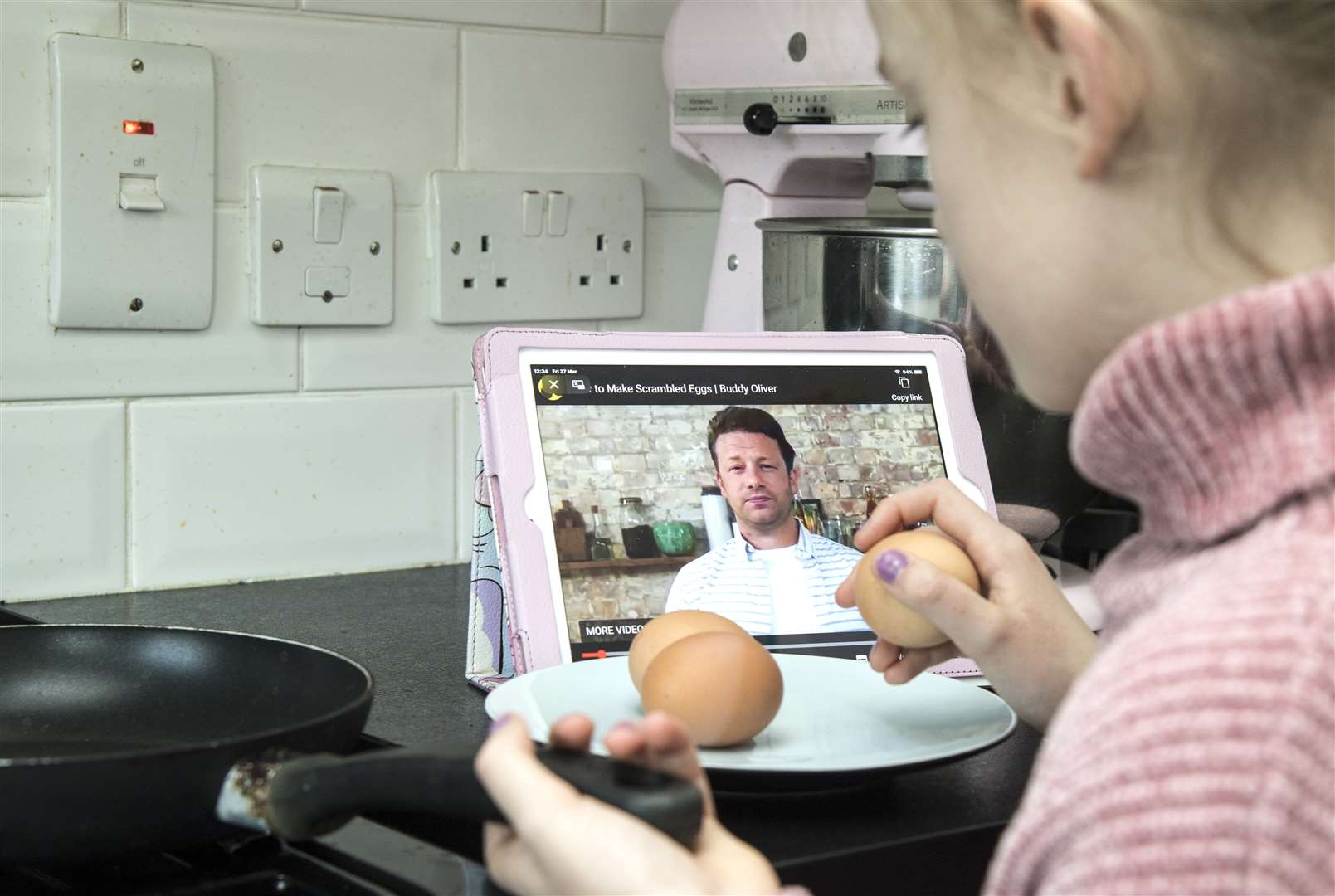 A child does some home cooking with Jamie Oliver while in isolation due to the coronavirus pandemic (Ian West/PA)