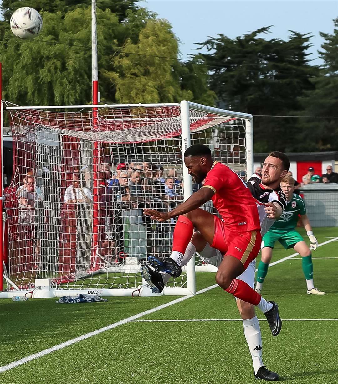 Whitstable striker Jerson Dos Santos wins a corner as he battles with Faversham defender Ben Gorham during the Lilywhites’ 3-0 Bank Holiday Monday win at The Belmont. Picture: Les Biggs