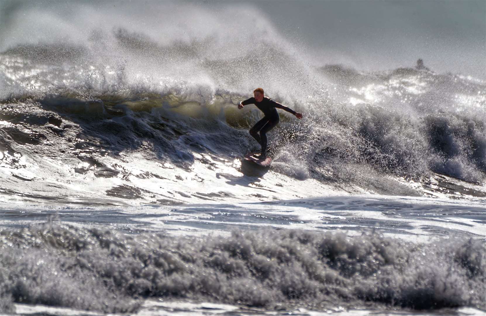 The unsettled summer continued into August, but stormy seas brought joy to some on Longsands beach on the North East coast (Owen Humphreys/PA)