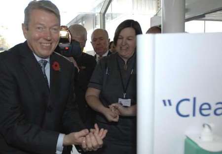 KEEPING CLEAN: Alan Johnson washing his hands on his arrival at Maidstone Hospital on Thursday. Picture: GRANT FALVEY