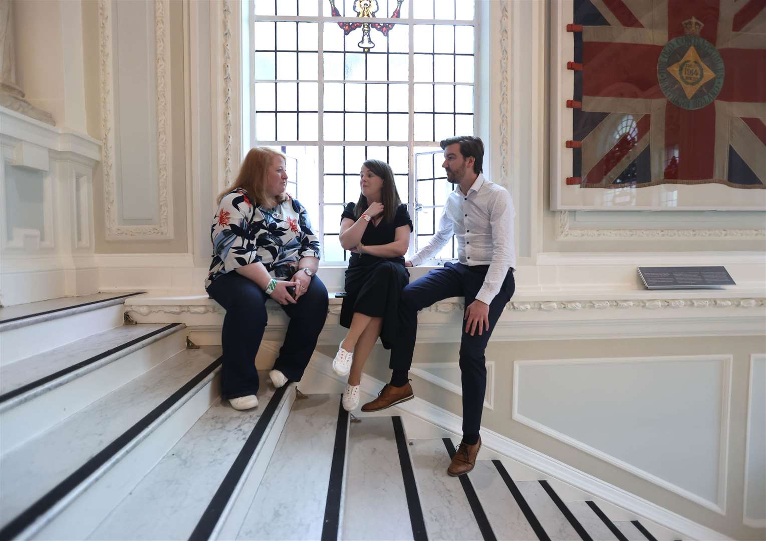 Alliance Party leader Naomi Long, left, with Nuala McAllister and Sam Nelson at Belfast City Hall as the results come in (Liam McBurney/PA)