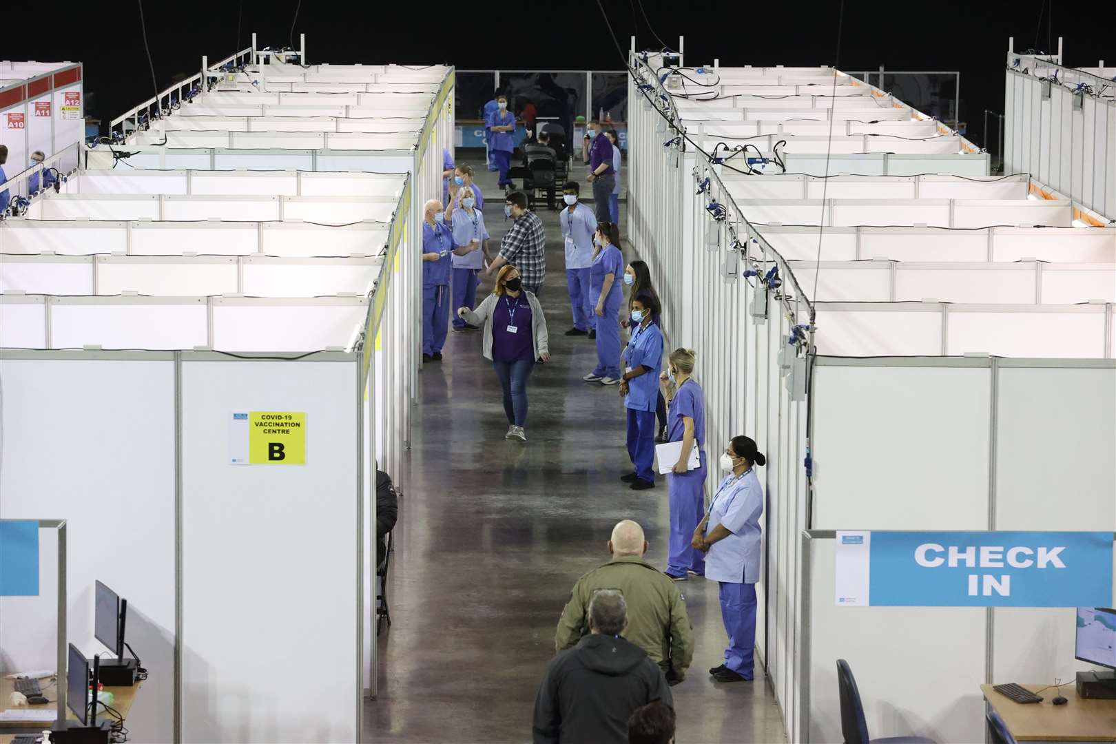 People attending the Covid-19 vaccination centre in the SSE Arena (Liam McBurney/PA)