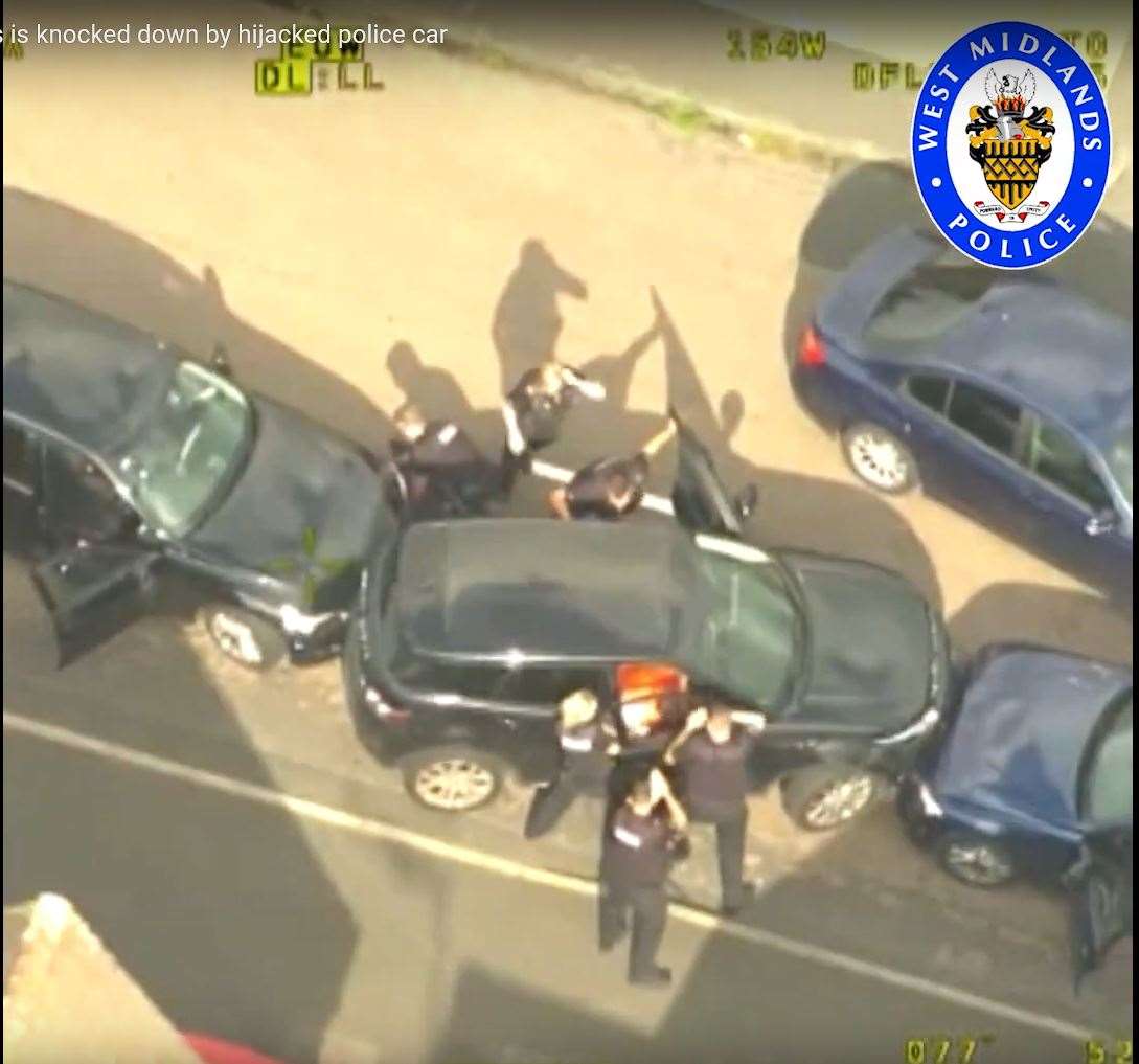 Police helicopter footage released last year shows Pc Gareth Phillips among officers attempting to detain car thief Mubashar Hussain (West Midlands Police/PA)