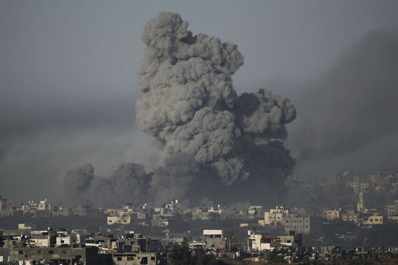 Smoke rises following an Israeli air strike in the Gaza Strip (AP)