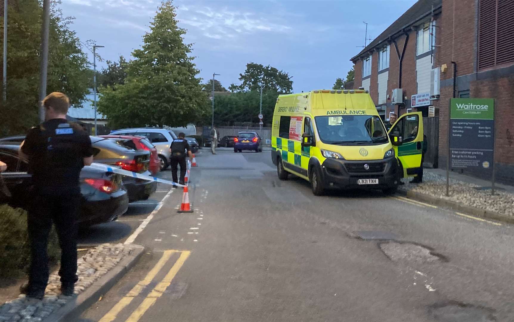 Police and the ambulance service at the scene behind Waitrose