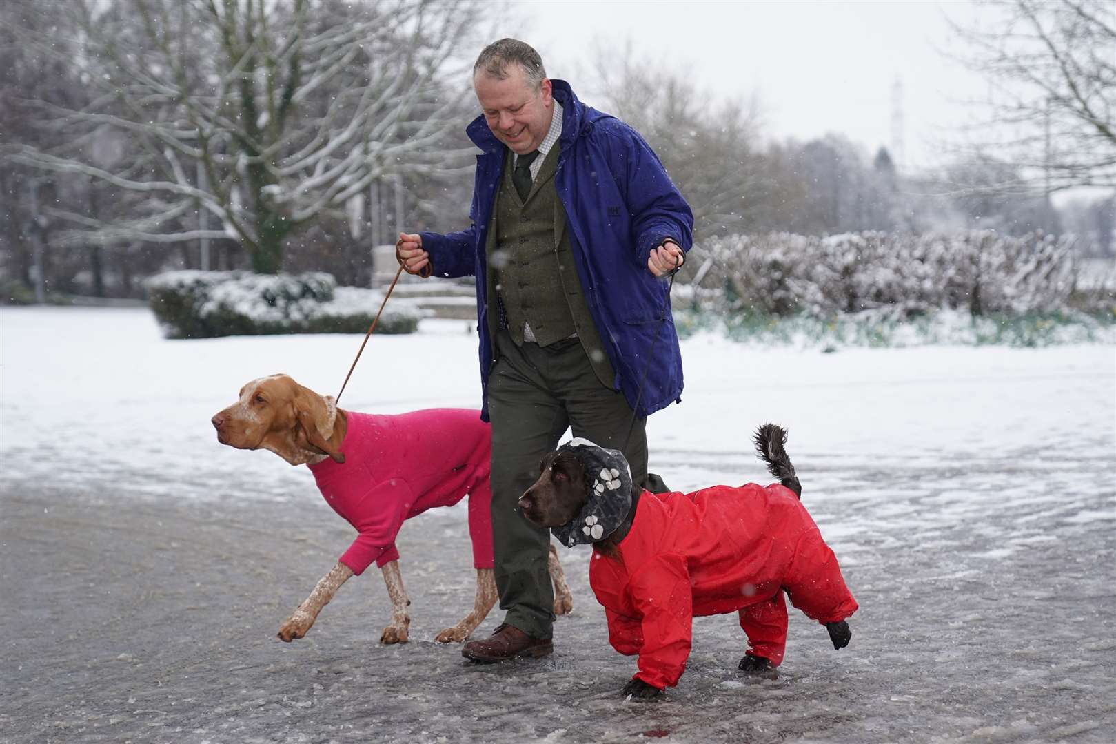 A man arrives with dogs on the first day of Crufts (Jacob King/PA)