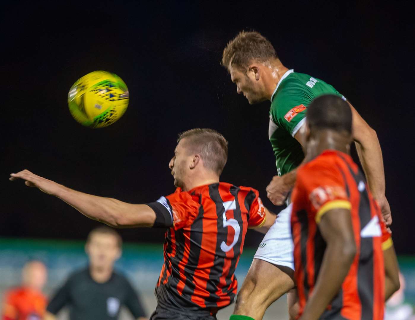 Ashford debutant Gary Lockyer wins a header. Picture: Ian Scammell