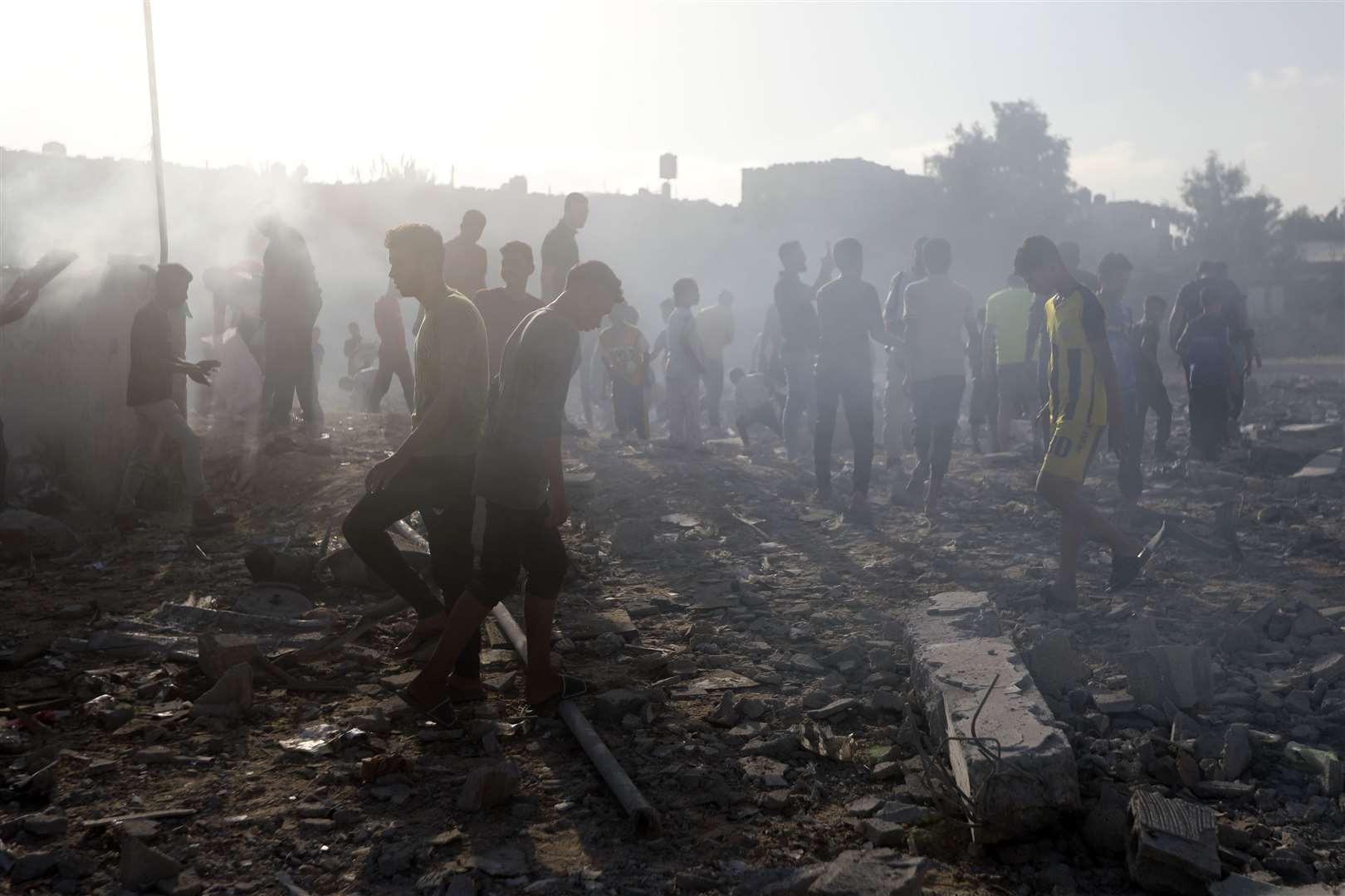 Palestinians inspect the damage of a destroyed mosque after an Israeli airstrike in Khan Younis refugee camp, southern Gaza Strip, on Wednesday (Mohammed Dahman/AP)