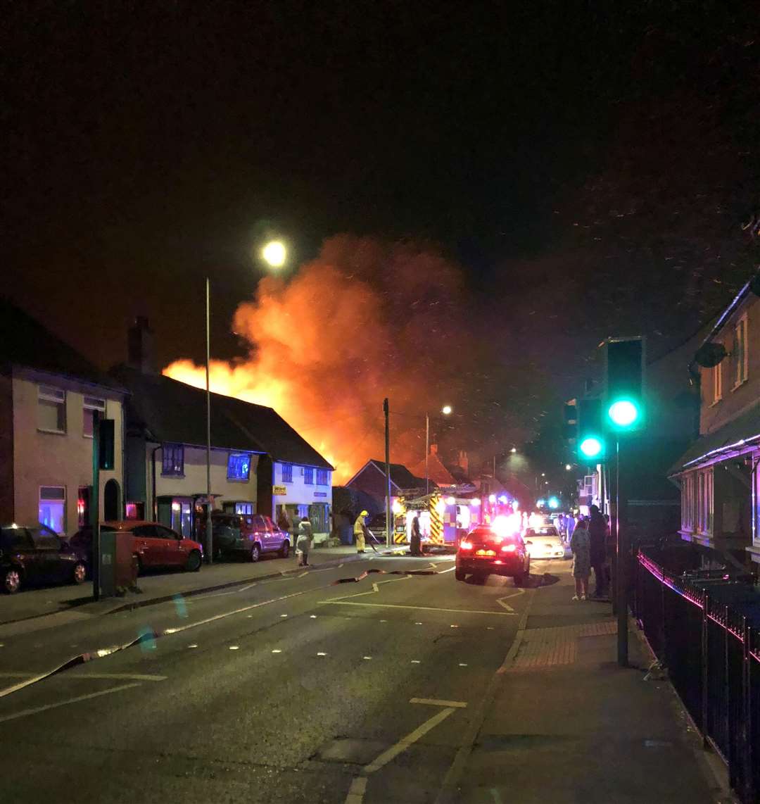 Flames burst through the roof of FJ Williams joinery in London Road, Teynham. Picture: Paul Mercer (5309072)