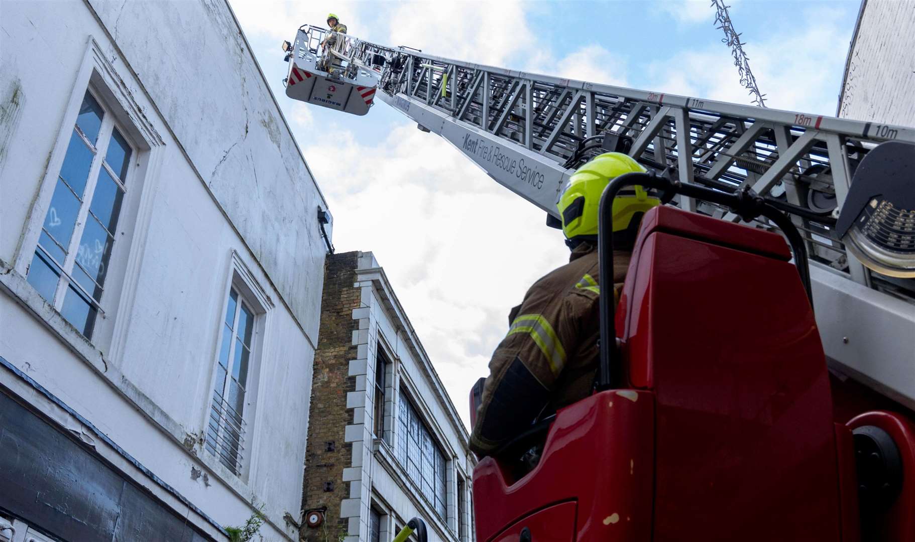 Firefighters using a height vehicle to reach the blaze in Canterbury High Street. Picture: KFRS