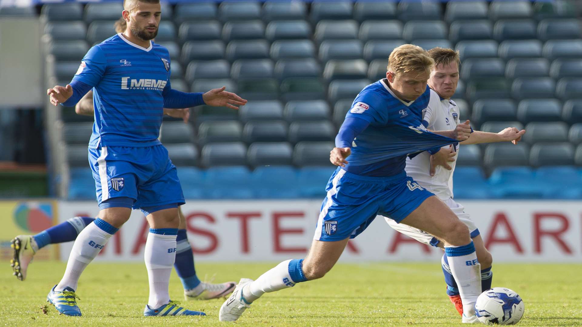 Josh Wright fights for possession in midfield Picture: Andy Payton