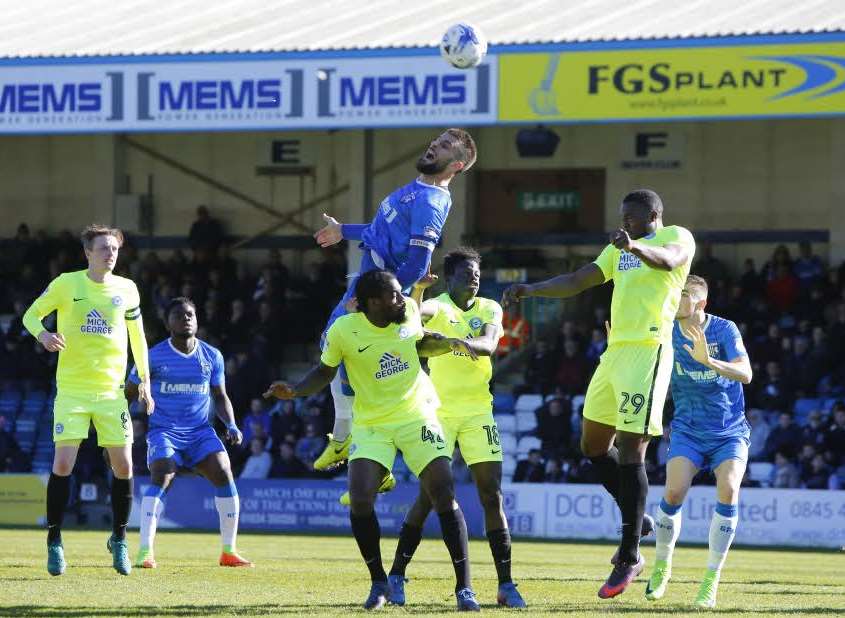 Max Ehmer in the air for Gillingham Picture: Andy Jones