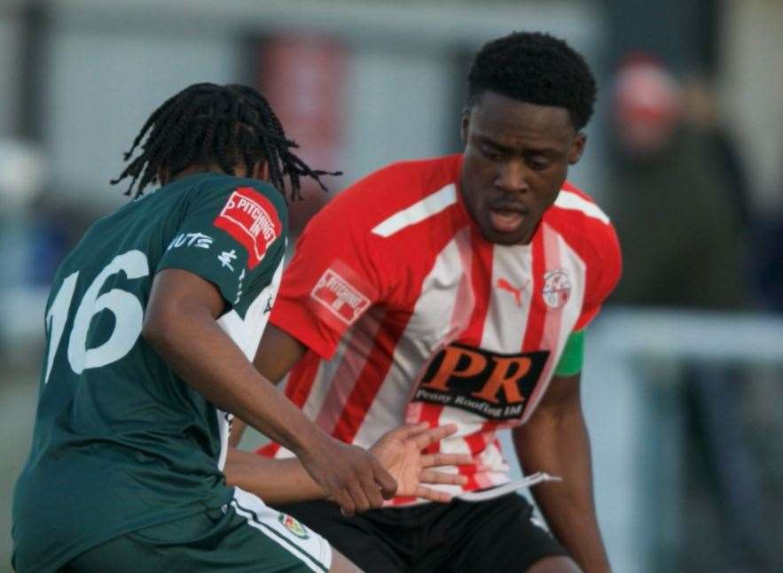 Ashford's Gabe Campbell takes on Sheppey defender Lekan Majoyegbe. Picture: Ian Scammell