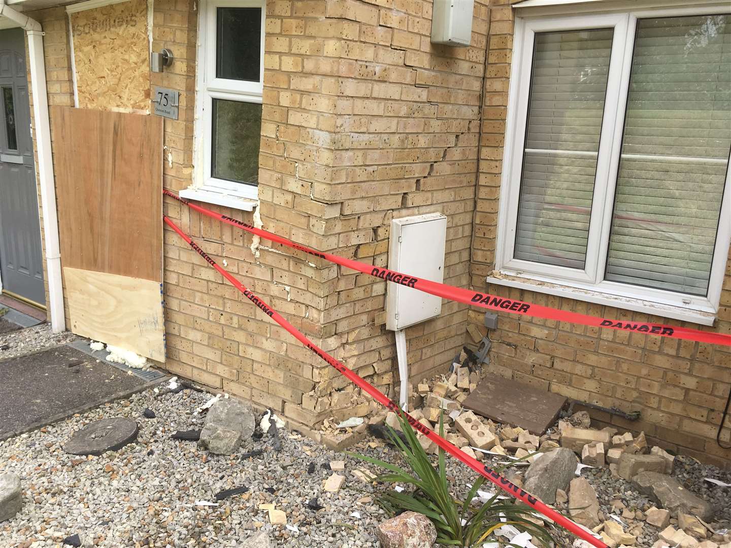 The front door had to be boarded up after a Vauxhall Astra car crashed into it in Quinton Road at the junction of Sonora Way, Sittingbourne (12397885)