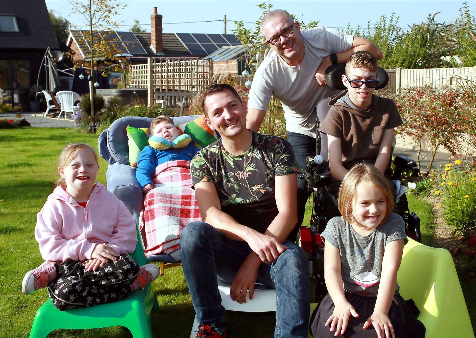 Kyle and Garry Ratcliffe with their children Bella, Curtis, Haydn and Phoebe