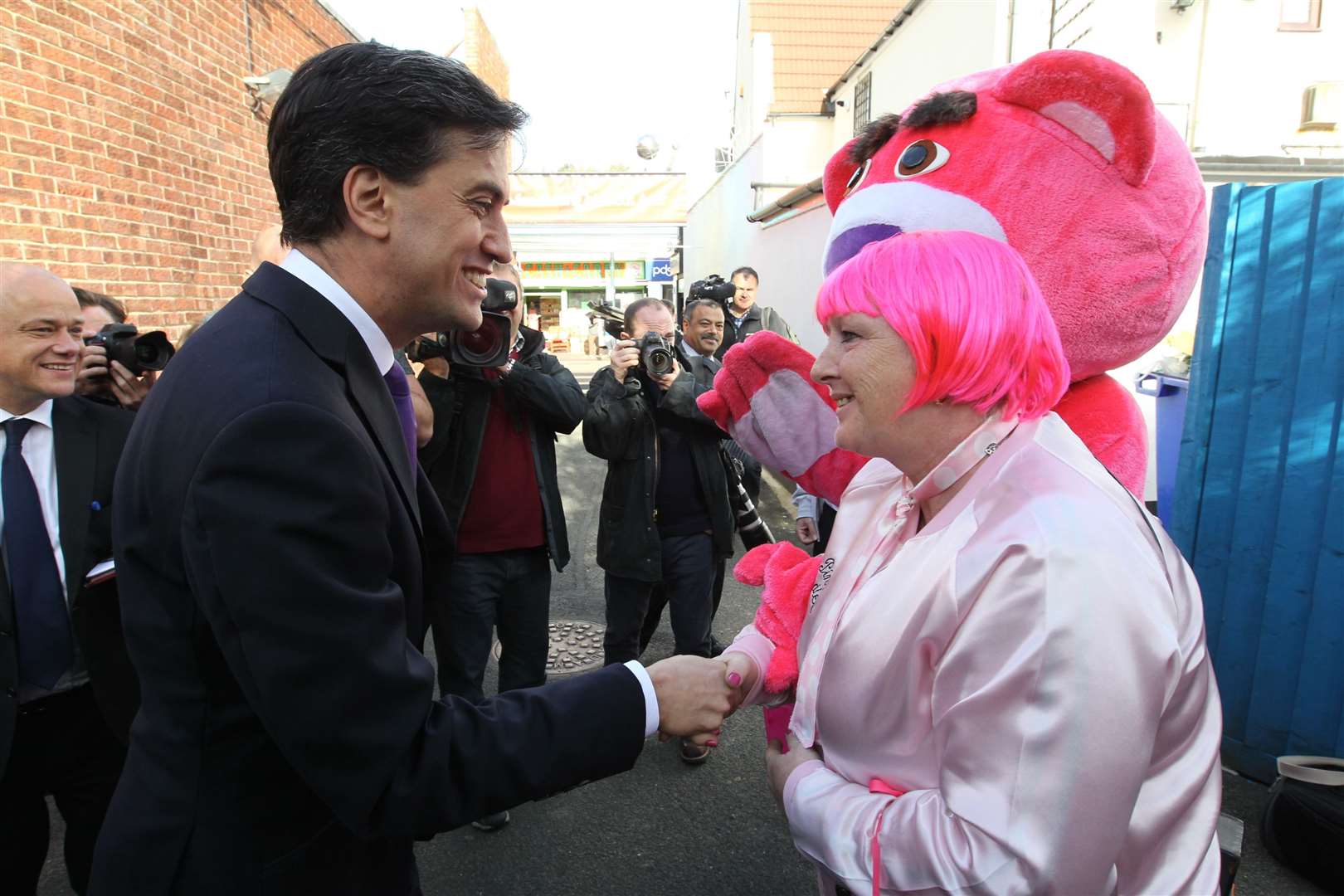 Labour Leader, Ed Miliband greets 'Maggie' Lady in Pink for Breast Cancer awareness in Chatham, with the big pink bear behind