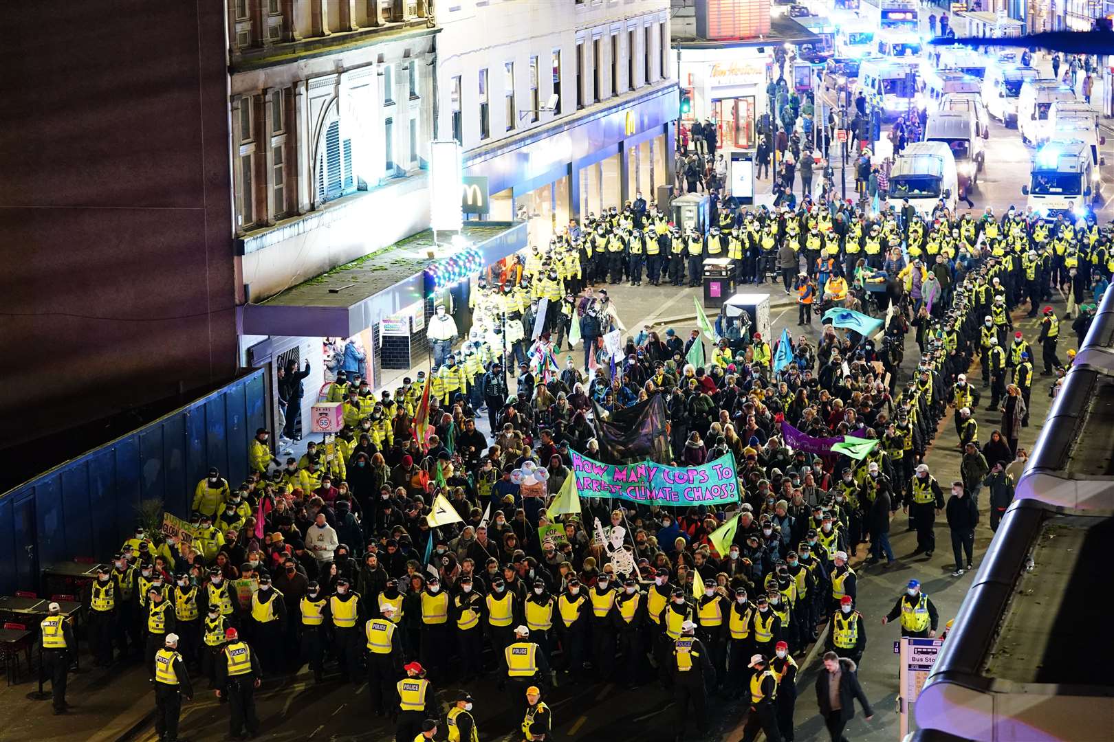 A group were kept within a police cordon as they marched towards Cop26 (Jane Barlow/PA)