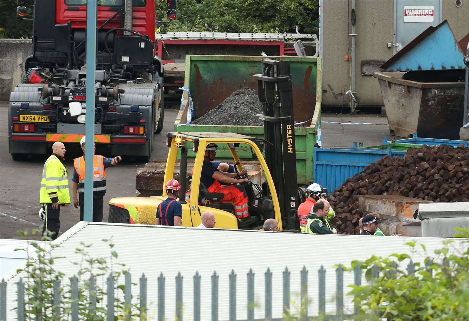 Paramedics and fire crews at Hawkeswood Metal Recycling following the wall collapse (Chris Radburn/PA)