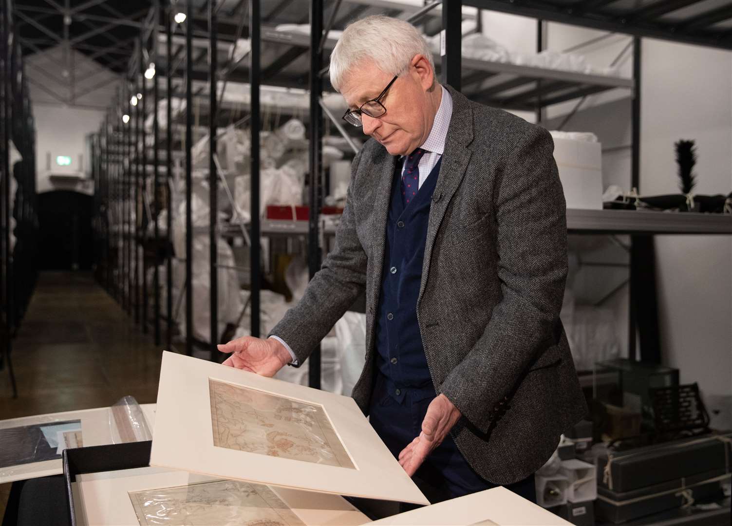 Professor Dominic Tweddle, director general of the National Museum of the Royal Navy, looks at one of the armada maps at Portsmouth Historic Dockyard (Andrew Matthews/PA)