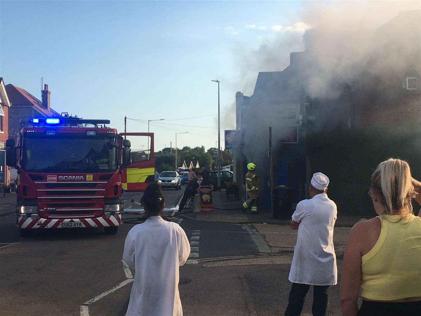 Servet's staff look on as firefighters tackle the blaze. Picture: Michael Godfrey