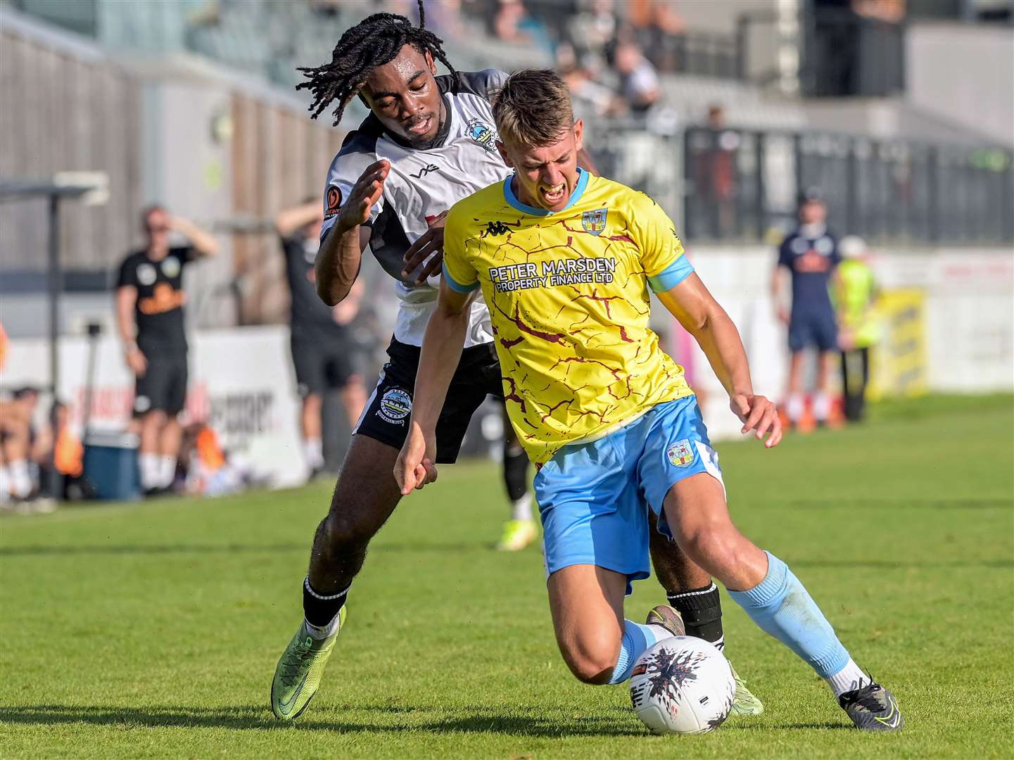 Dover substitute and scorer Roman Charles-Cook closes down an away player in Whites’ 3-1 weekend home defeat to Weymouth. Picture: Stuart Brock