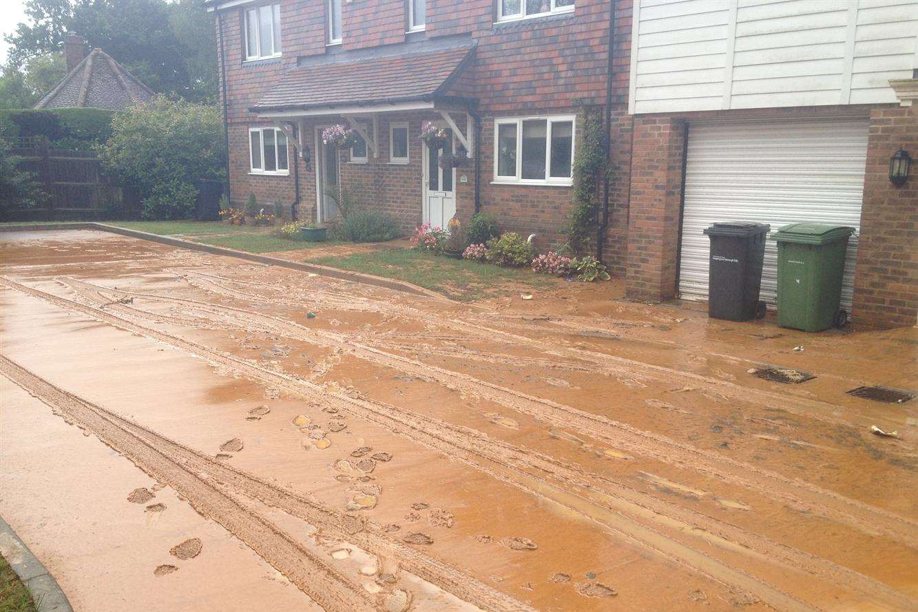 Paygate off Sutton Road was flooded after clay from Imperial Park development was washed down the hill during heavy rain on Sunday