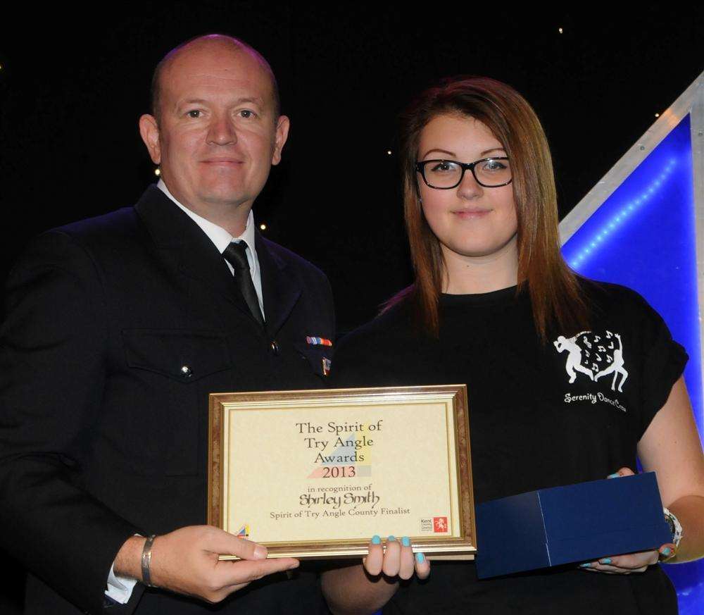 Shirley Smith receives the bravery award from Nick Silvester from Kent Fire and Rescue at the Gravesham Tryangle Awards.