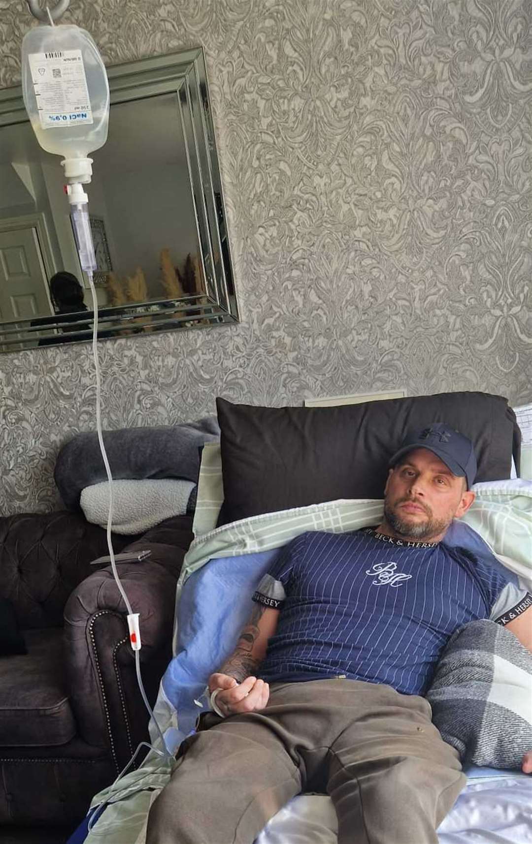 Rick Smith with an IV drip at his home in Thistle Hill Sheerness. Picture: Katrina Binfield