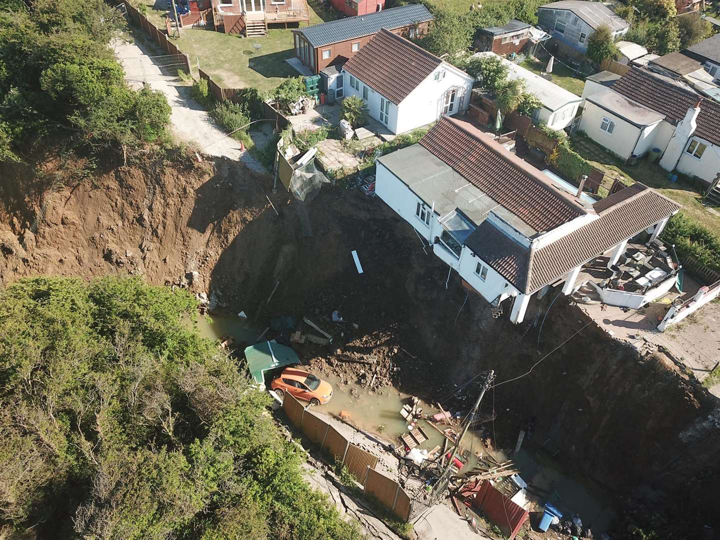 Emma Tullett's family home at Surf Crescent, Eastchurch, when it was hanging over the edge. Picture: Henry Cooper