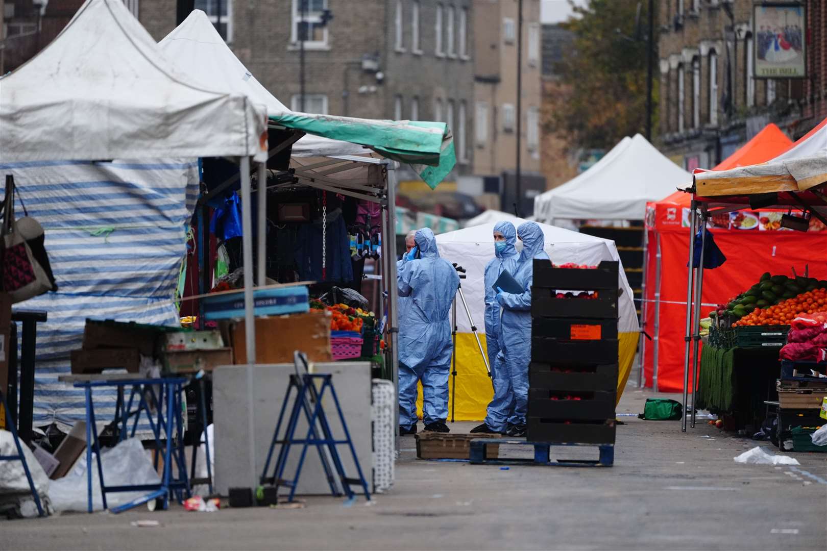 Forensic officers at the scene in East Street, Walworth, south London, following a fatal stabbing (Aaron Chown/PA)