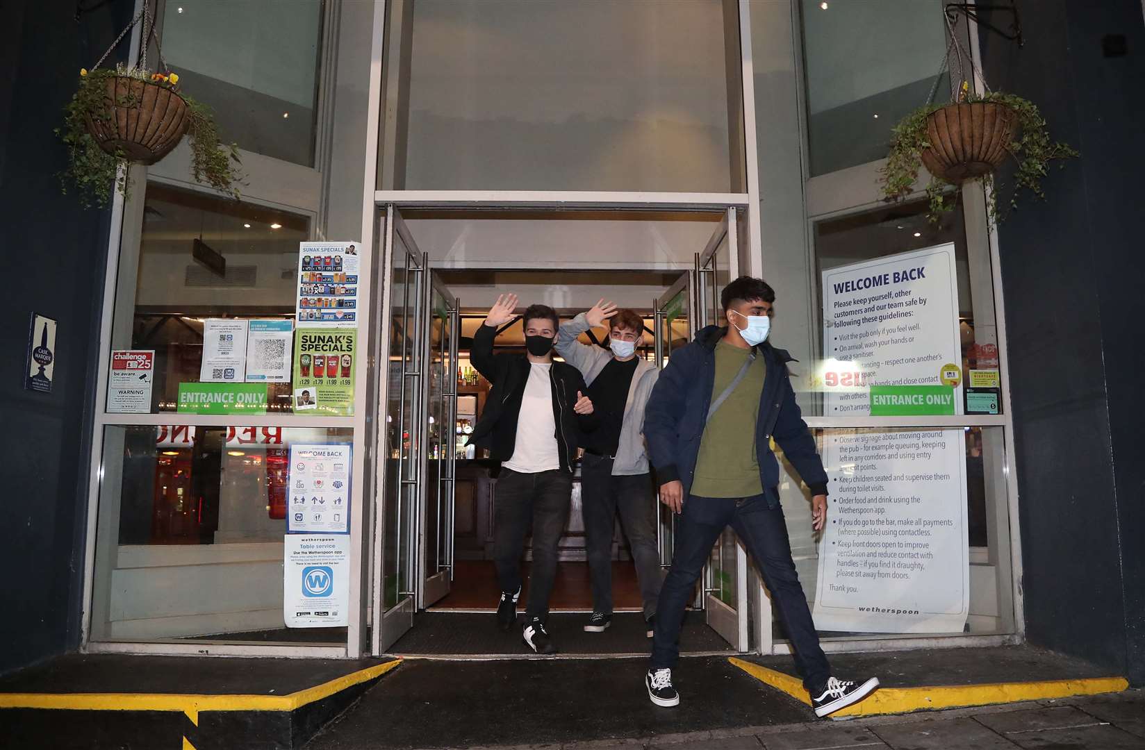 People leave a Wetherspoon’s pub in Brighton in September 2020 (Gareth Fuller/PA)