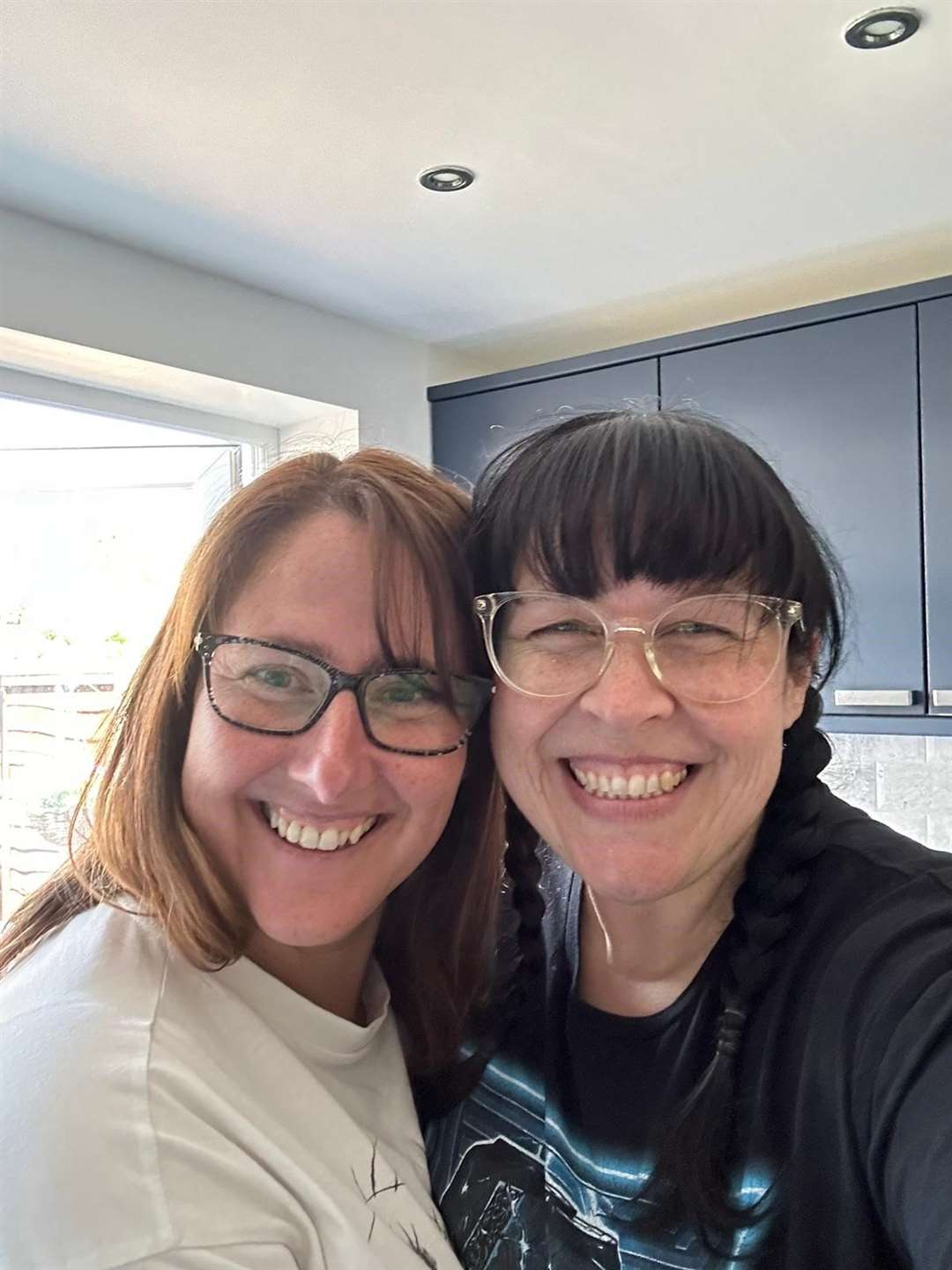 Artist Heidi Gentle Burrell (right) with friend Jenny Lodge who helped her set up the ADHD exhibition (Heidi Gentle Burrell/PA)