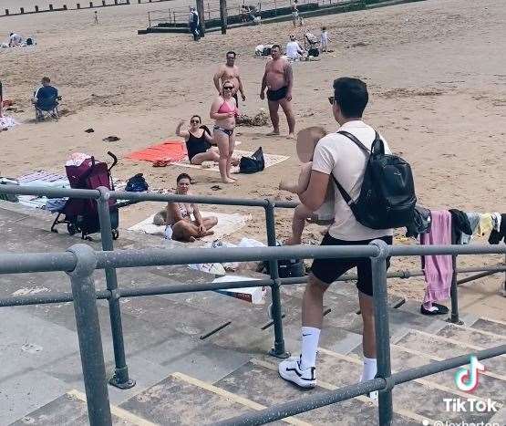 Michael Currid finds the toddler crawling up beach steps. Picture: Jam Press