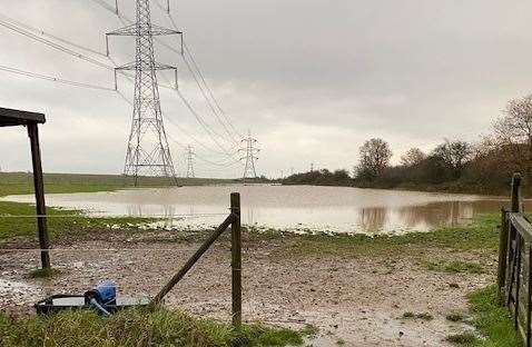 Flooding on Marie Bennett's land, which she believes is caused by the nearby Amazon depot