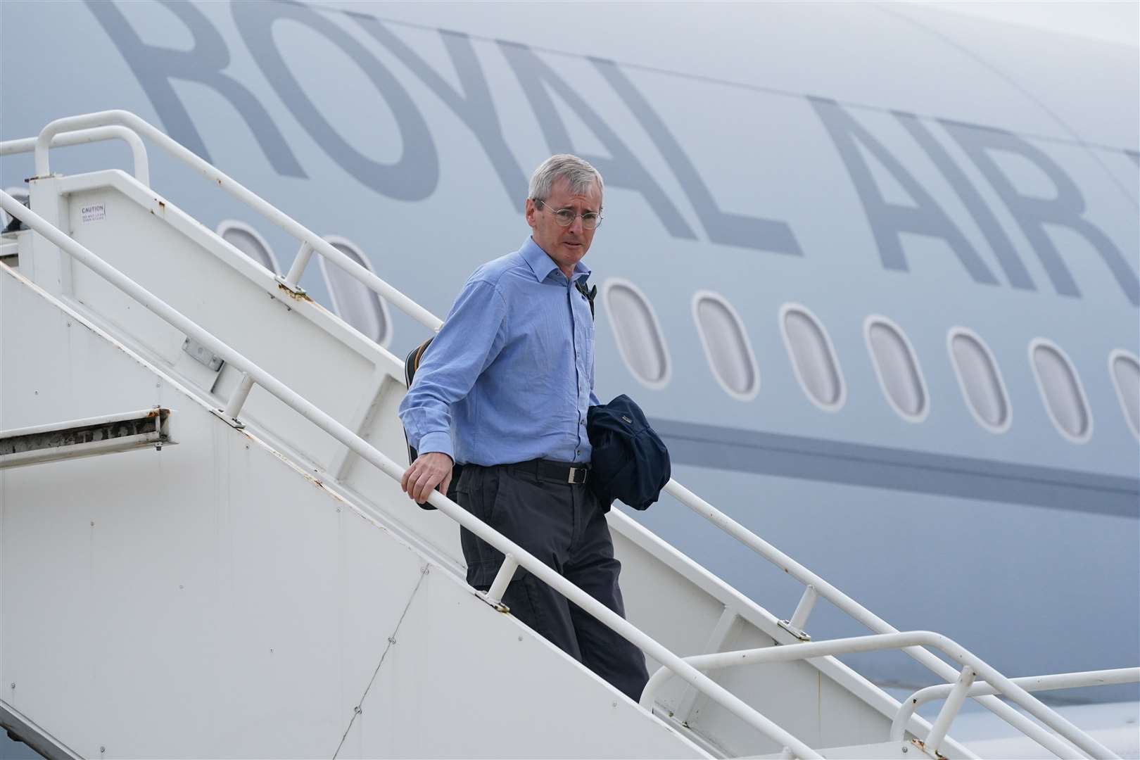 Ambassador to Afghanistan Sir Laurie Bristow exits a plane at RAF Brize Norton after being evacuated from Kabul (Jonathan Brady/PA)