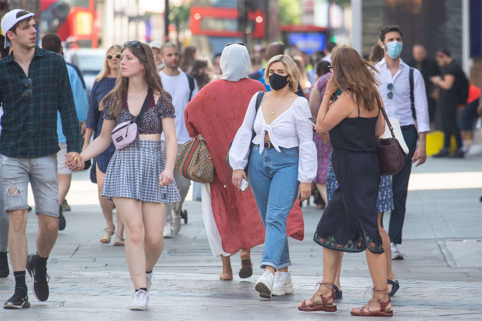 Some people were still wearing face masks in central London (Dominic Lipinski/PA)