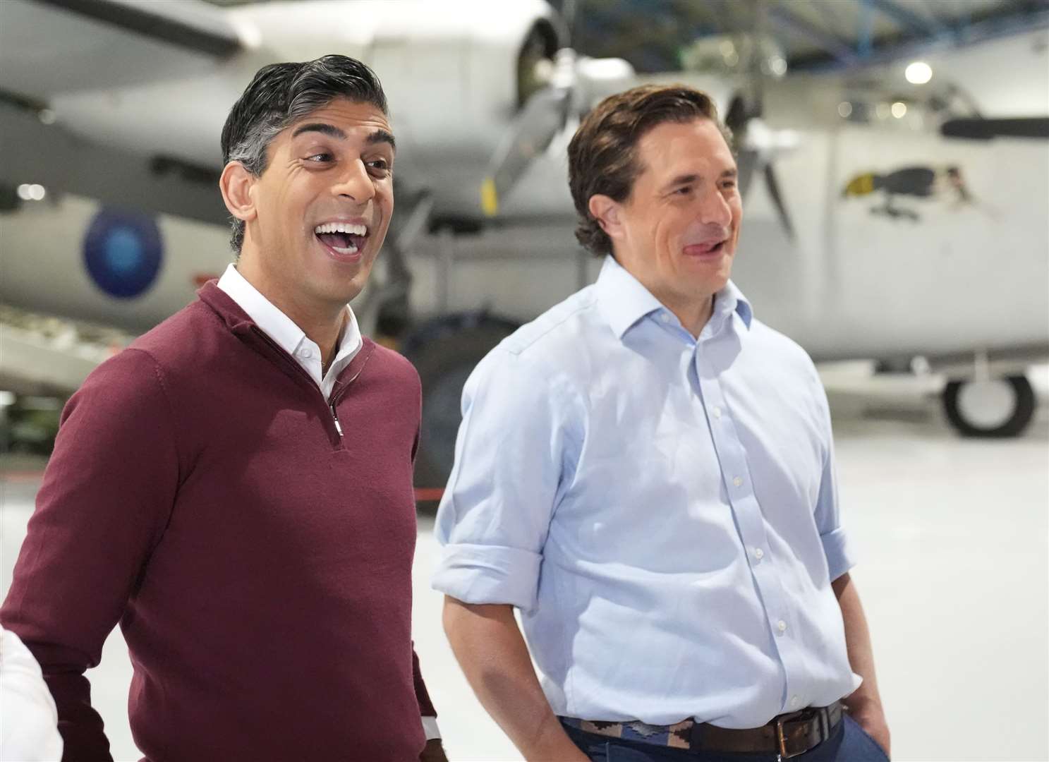 Johnny Mercer and Rishi Sunak share a laugh (Stefan Rousseau/PA)