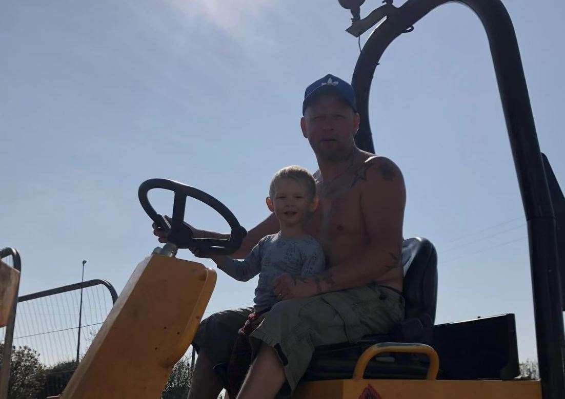 Peter Chadwick and his son on a digger during the initial stages of construction
