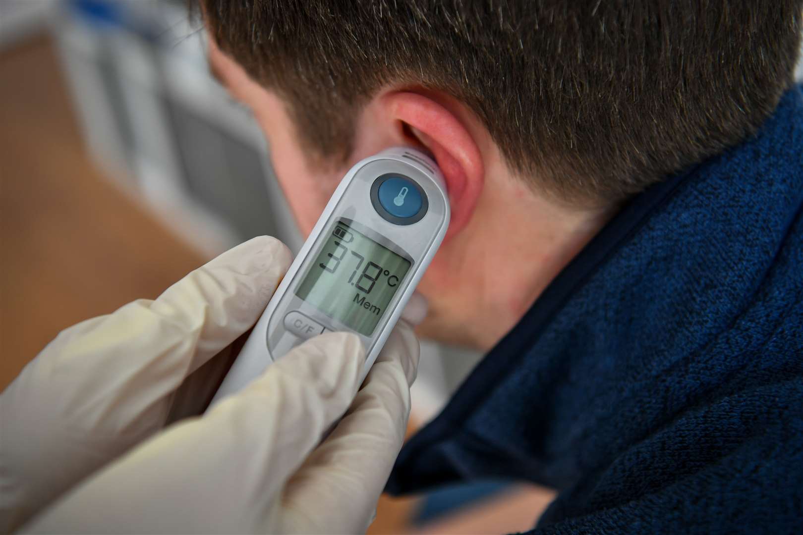 A high temperature is recognised by PHE as a symptom of Covid-19 (Ben Birchall/PA)