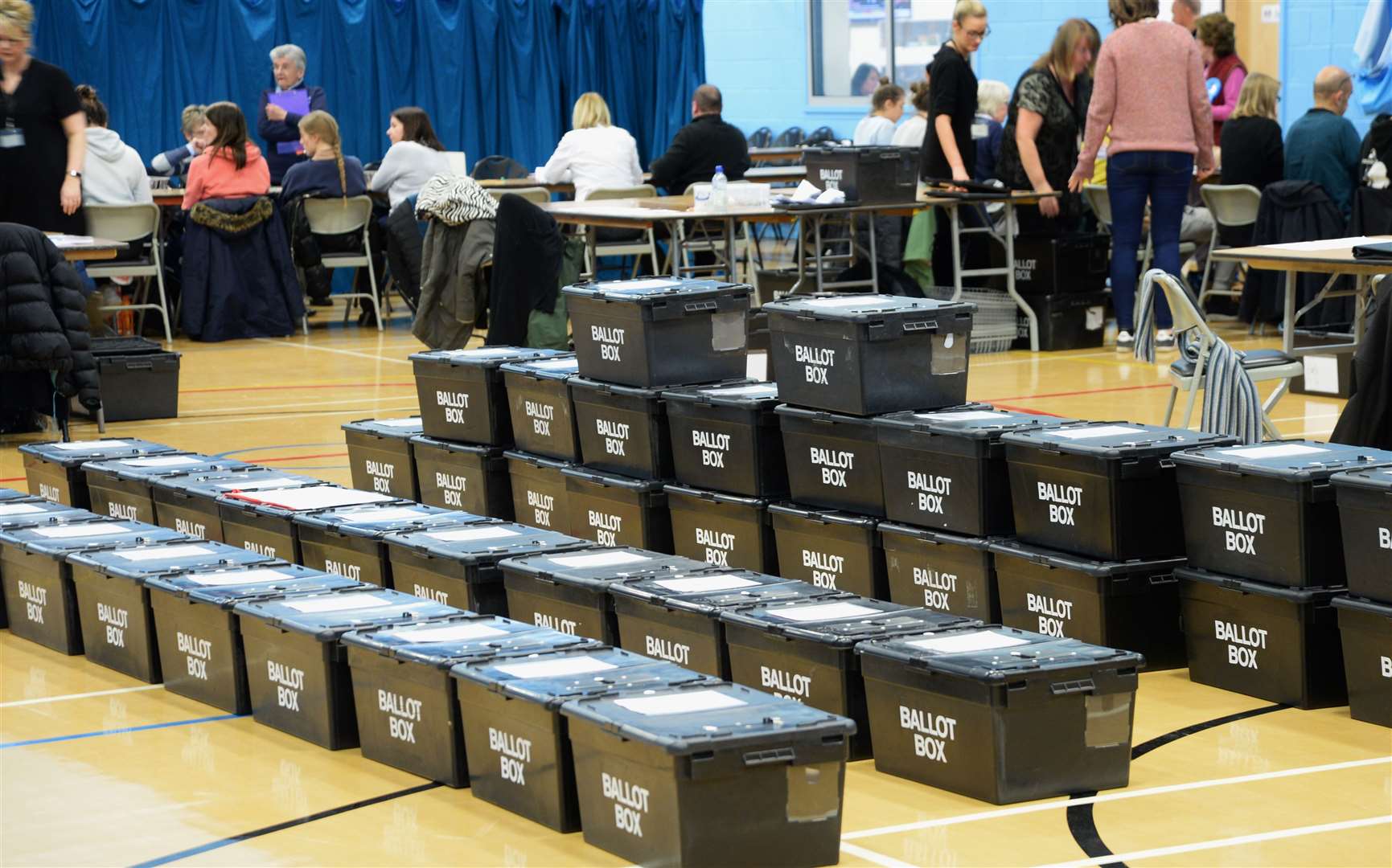 A stack of ballot boxes await checking