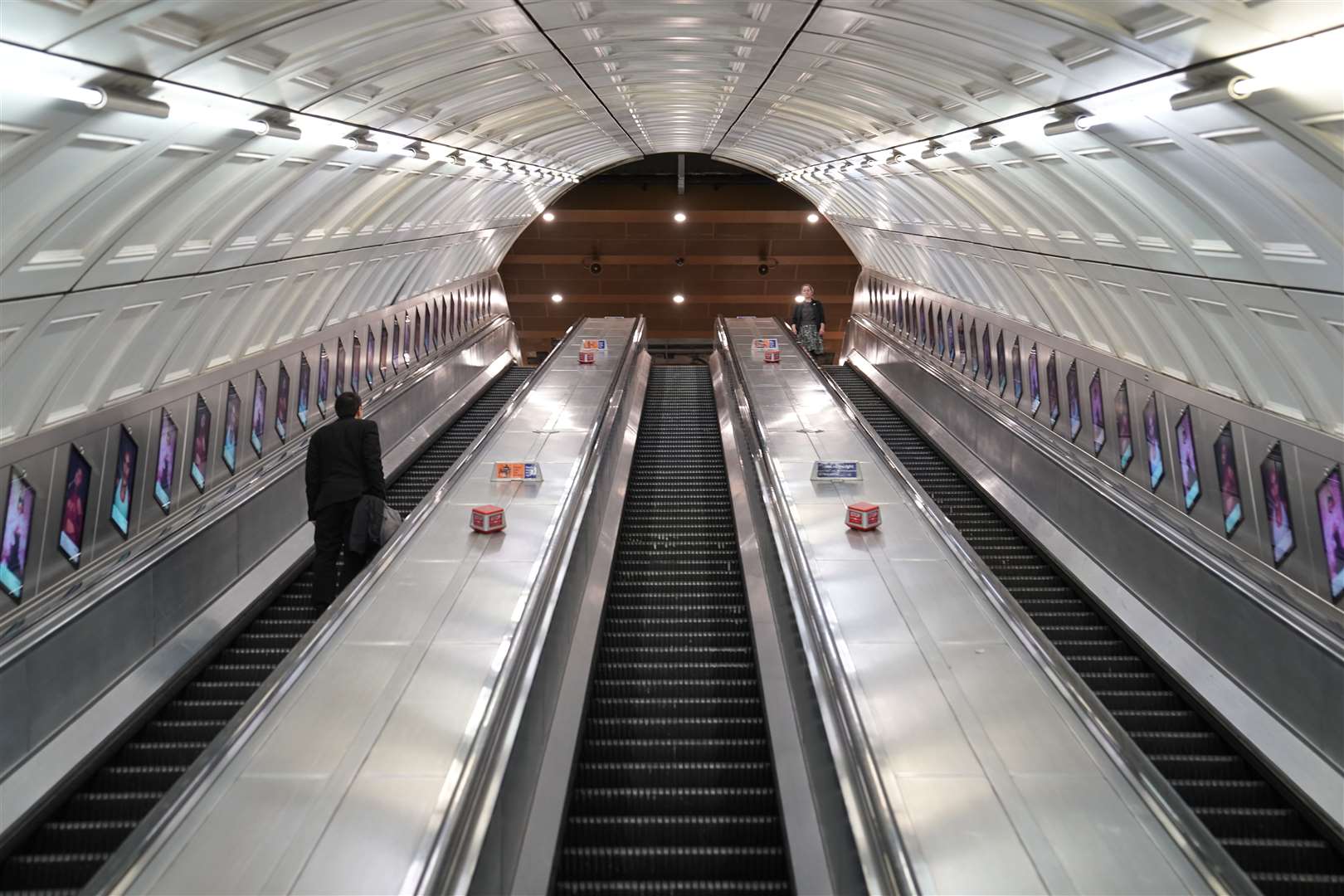 Two people on a escalator at Liverpool Street Station in east London (Stefan Rousseau/PA)