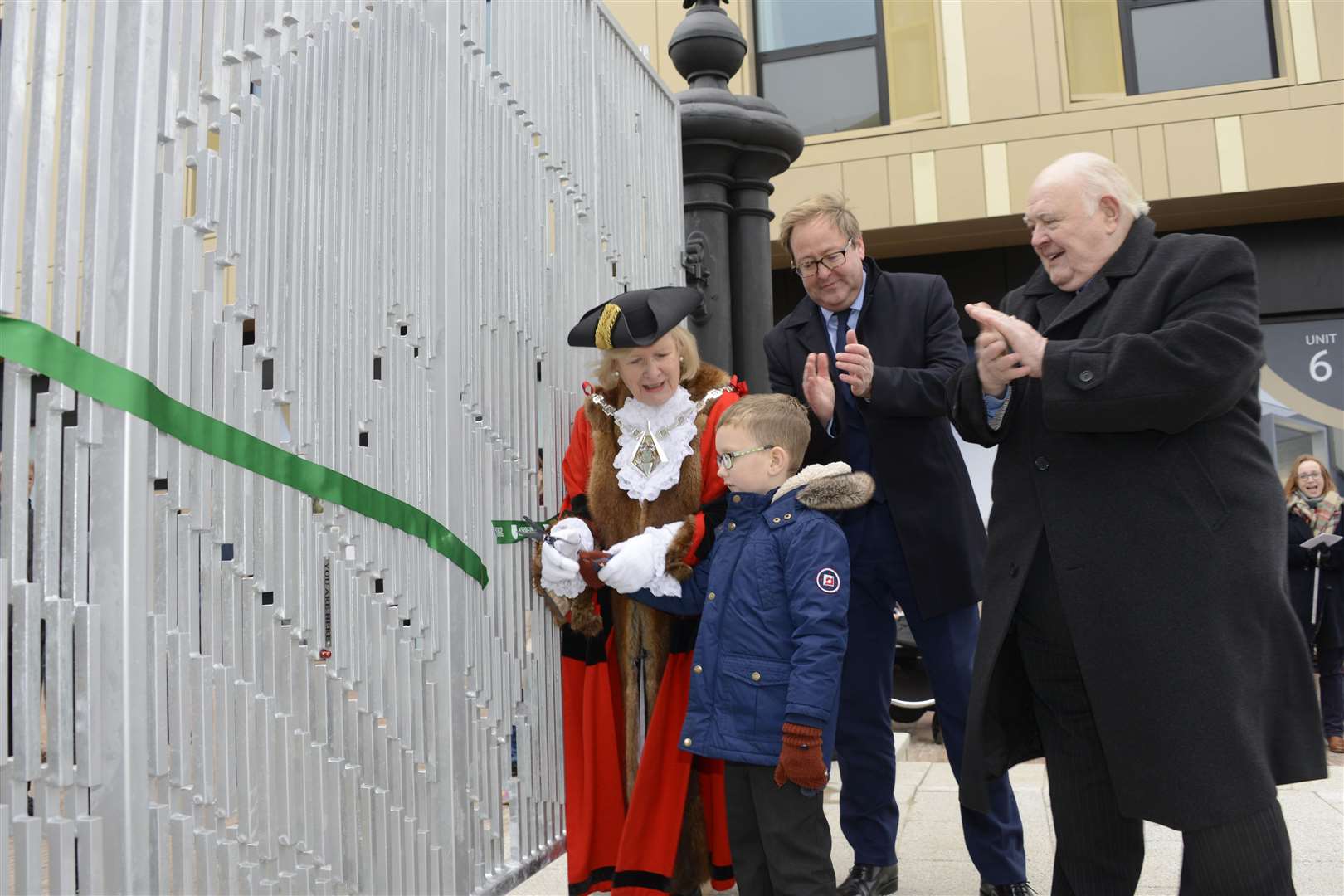 Cllr Gerry Clarkson, former Ashford Mayor Cllr Jessamy Blanford and Stanhope Plc director Gary Bourne perform the opening with the help of Henry Rowles. Picture: Paul Amos