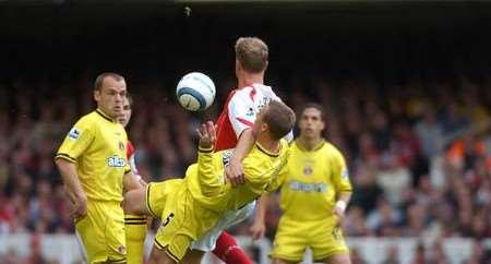 Charlton's Chris Perry is held up by Dennis Bergkamp. Picture: BARRY GOODWIN