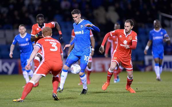 Gillingham's Conor Wilkinson against MK Dons' Dean Lewington and Ed Upson Picture: Ady Kerry (1341577)