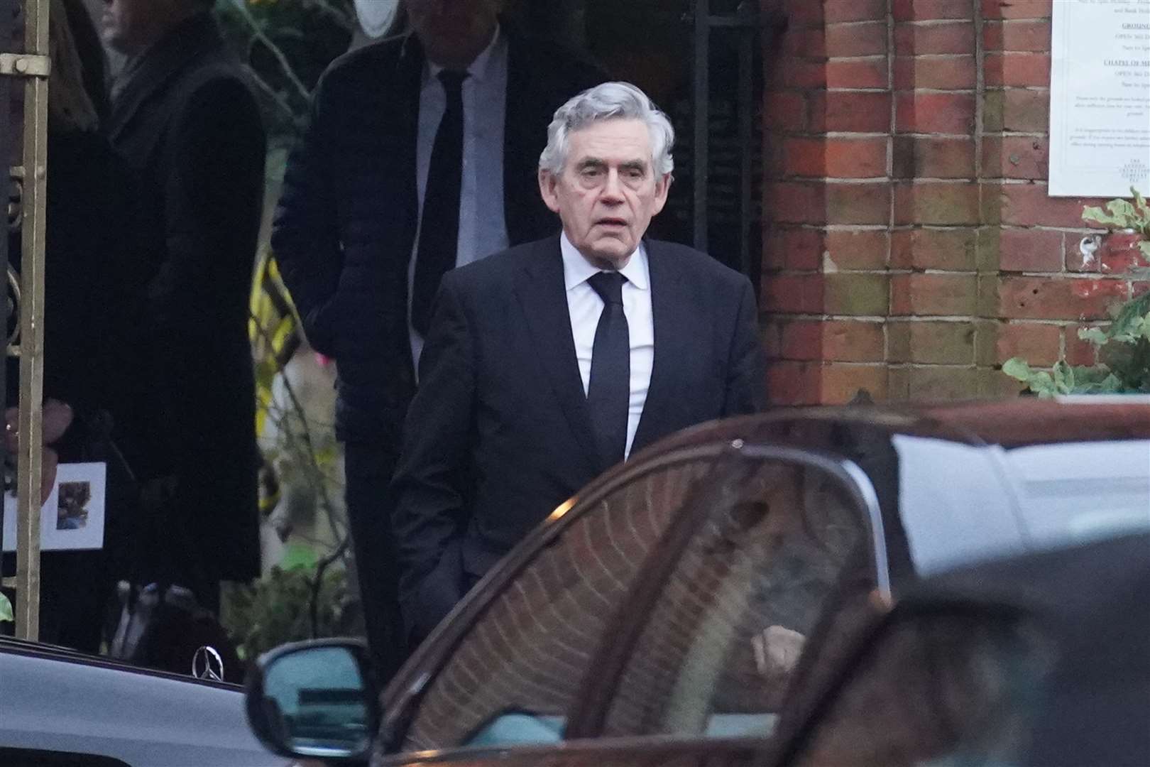 Former prime minister Gordon Brown departs the funeral service (Stefan Rousseau/PA)