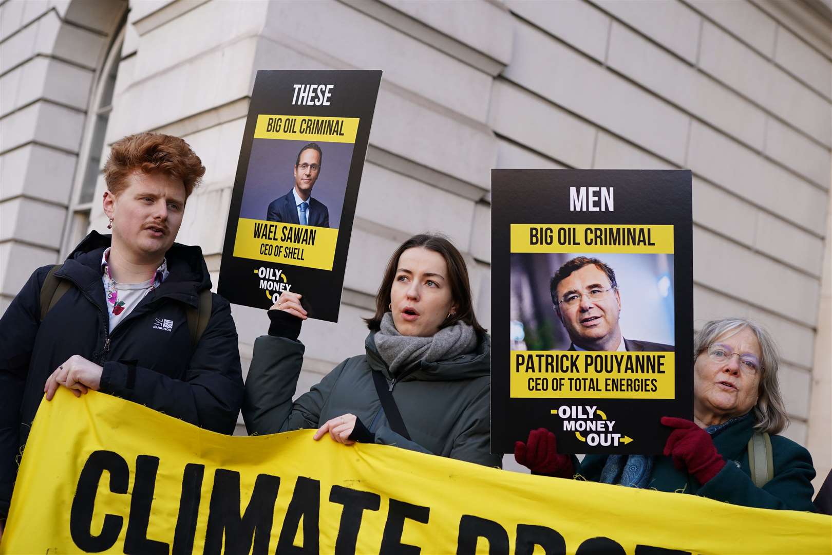 Environmental protesters held banners and signs outside the court (Jordan Pettitt/PA)