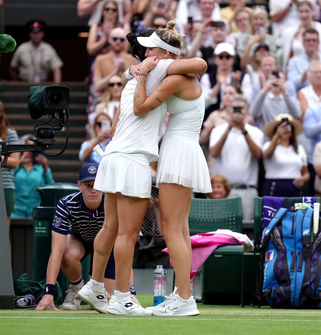 Vondrousova and Jabeur hugged on court (John Walton/PA)